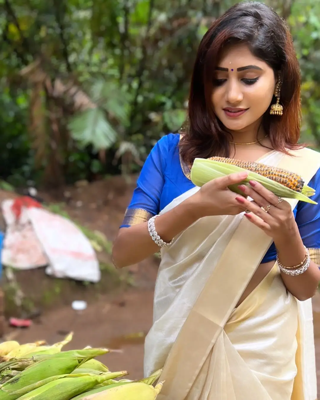 Vasanthi Krishnan Wearing Traditional White Saree Blue Blouse